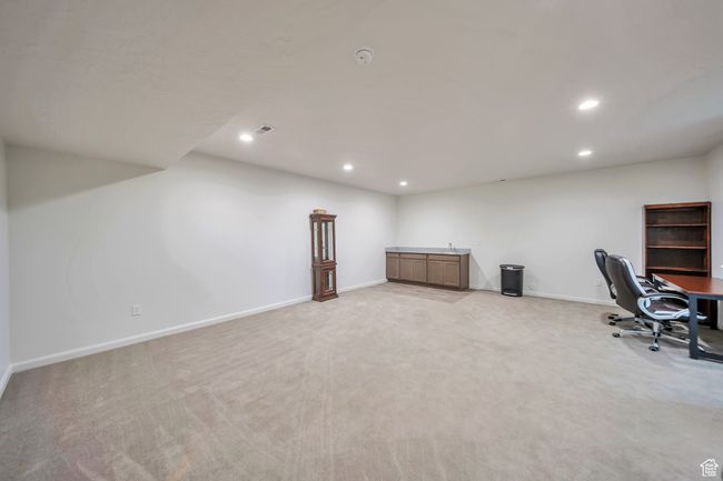 Unfurnished office with baseboards, light carpet, visible vents, and recessed lighting | Image 24
