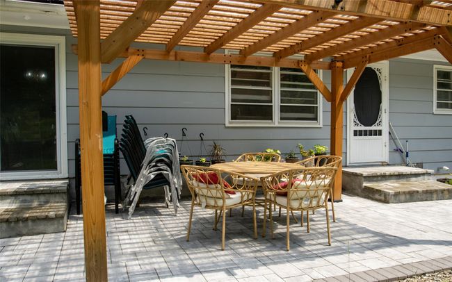 View of patio / terrace featuring outdoor dining space and a pergola | Image 8