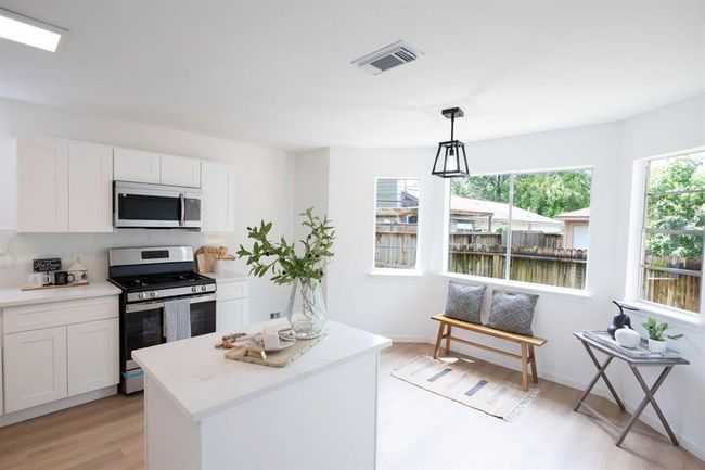 Enjoy your morning coffee in this bright, cheerful breakfast nook | Image 18