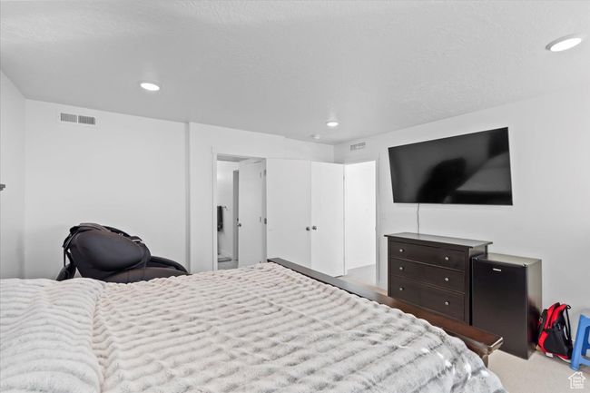 Carpeted bedroom with visible vents and recessed lighting | Image 11