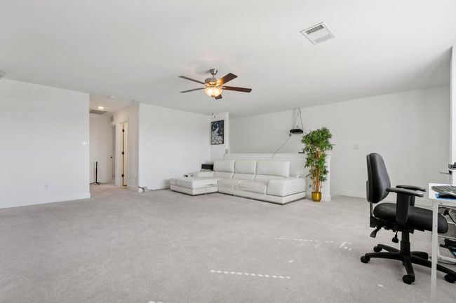 Office area featuring ceiling fan and carpet floors | Image 25