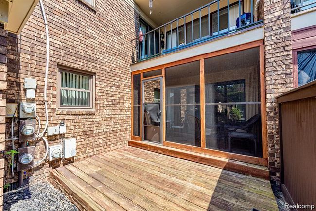Wooden deck featuring a sunroom | Image 32