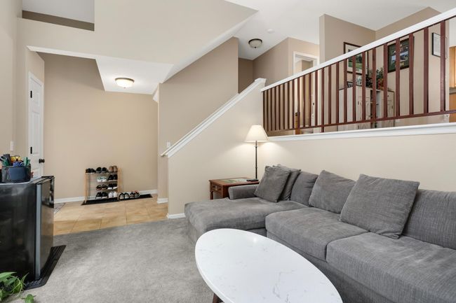 The stairway leads to the kitchen and dining room | Image 6
