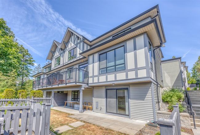 Rear view of property with a balcony and a patio area | Image 33