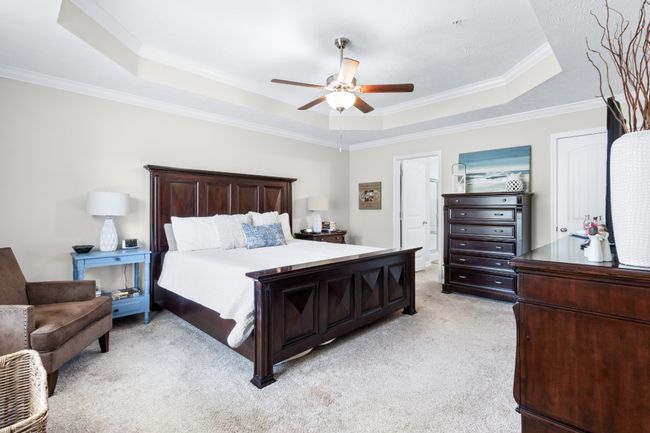 Luxurious primary suite with trey ceiling and ceiling fan.. plenty of room for lots of furniture. | Image 17