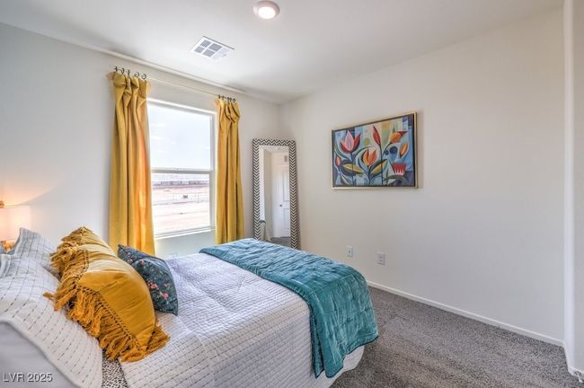 Carpeted bedroom featuring visible vents and baseboards | Image 30