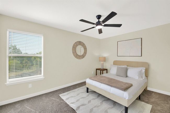 Carpeted bedroom featuring baseboards and ceiling fan | Image 9