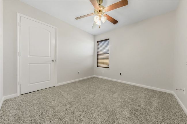Empty room featuring carpet floors and baseboards | Image 15
