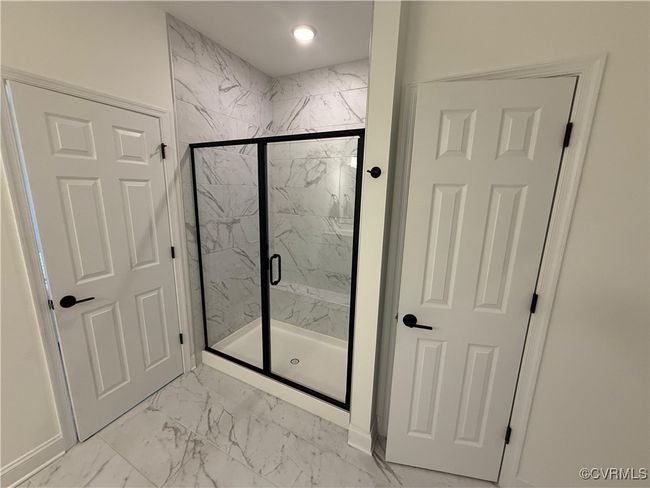 Bathroom with marble finish floors, a marble finish shower, baseboards, and recessed lighting | Image 12