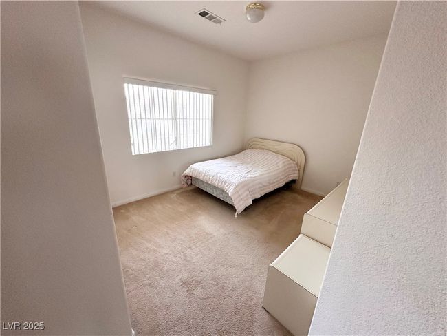 Bedroom with carpet flooring and baseboards | Image 16