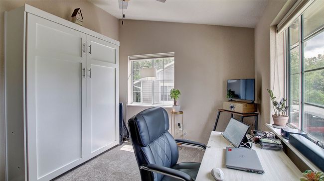 Office area featuring light carpet and a ceiling fan | Image 27