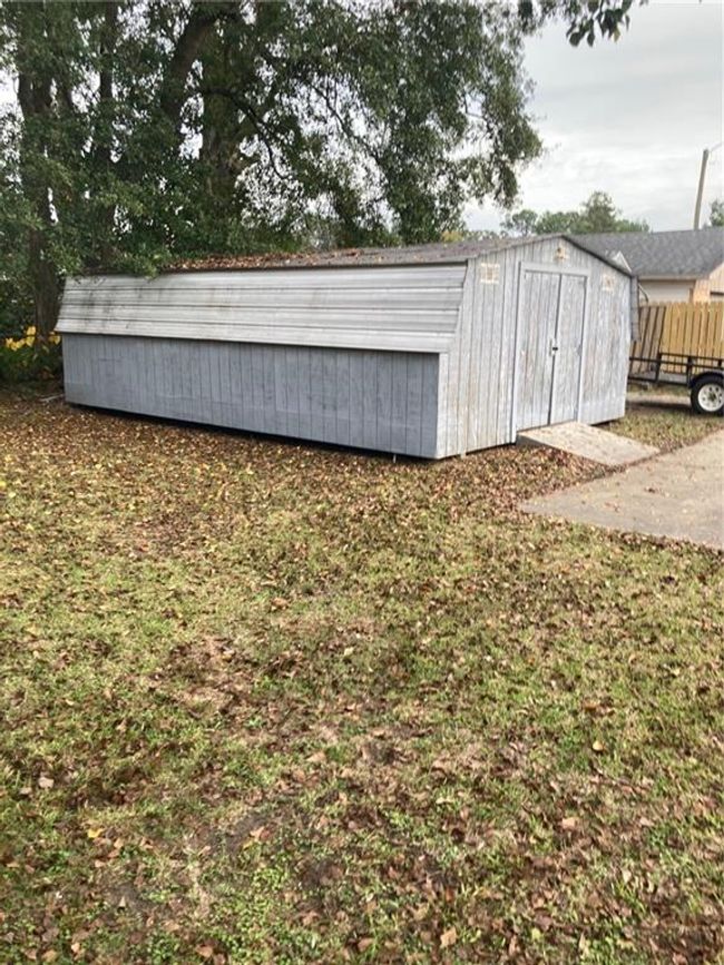 View of outbuilding with a yard | Image 4