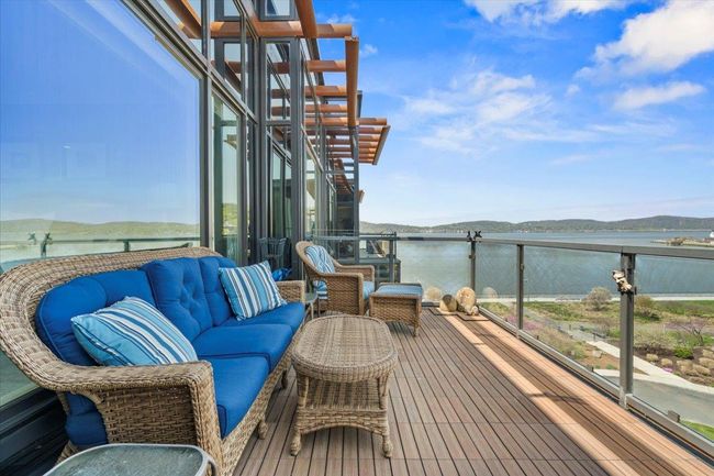 Balcony with a water view and outdoor lounge area | Image 22