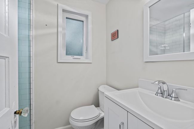 Bathroom featuring toilet and vanity | Image 4
