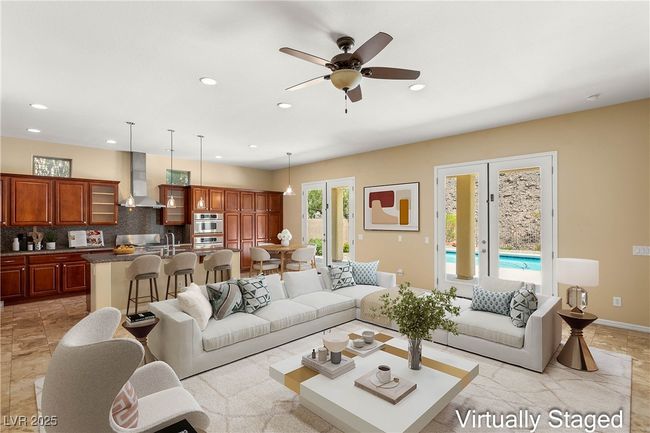 Living area featuring ceiling fan, recessed lighting, and baseboards | Image 4