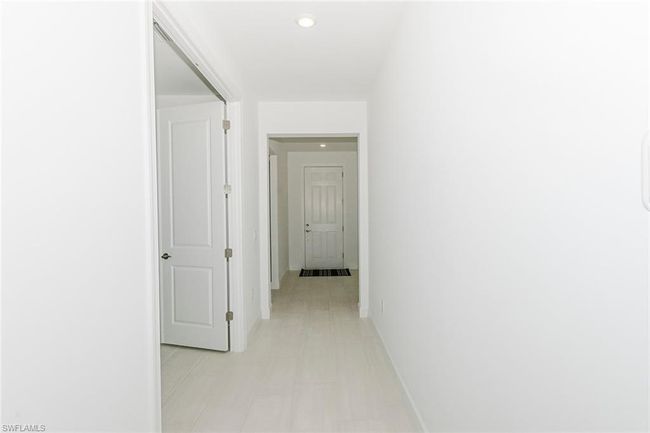 Hall with baseboards and recessed lighting | Image 13
