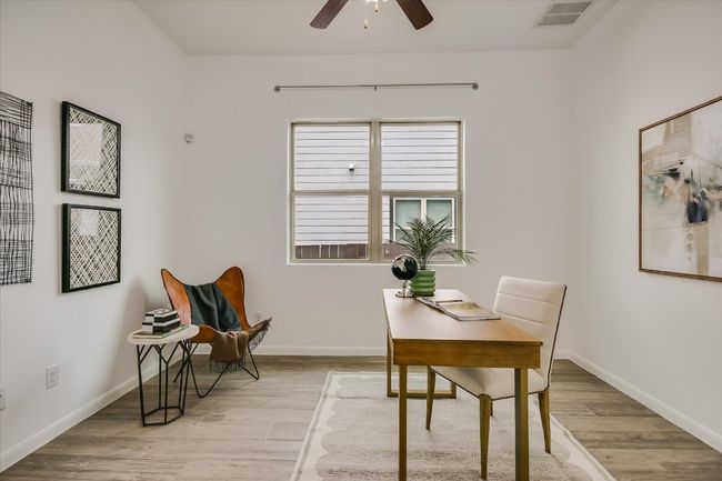 Tucked behind glass-paned double doors, the private, designated office is a "must-have" in this modern work from home era. | Image 6