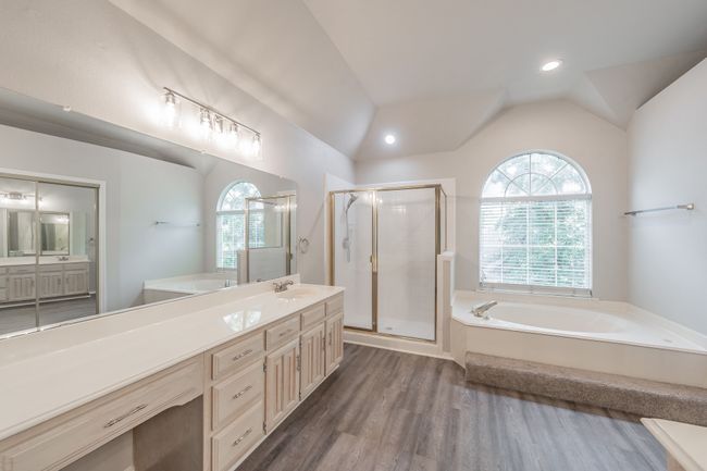 Primary en-suite bathroom featuring updated lighting and recessed lights. | Image 24