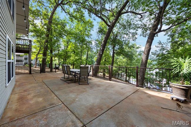 View of patio with outdoor dining area | Image 26