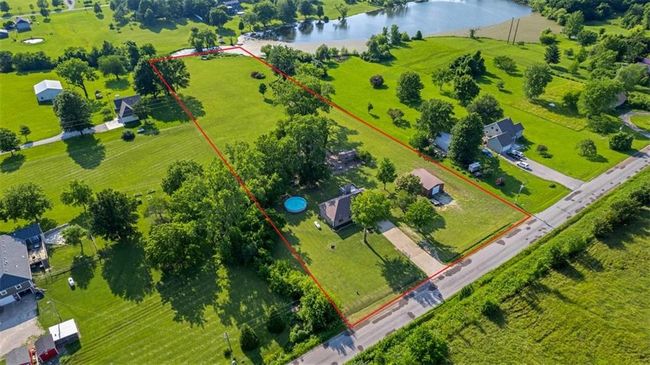 View of property location with property parcel outlined and a nearby body of water | Image 26