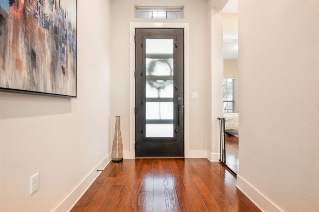 Entryway with hardwood / wood-style flooring and baseboards | Image 5