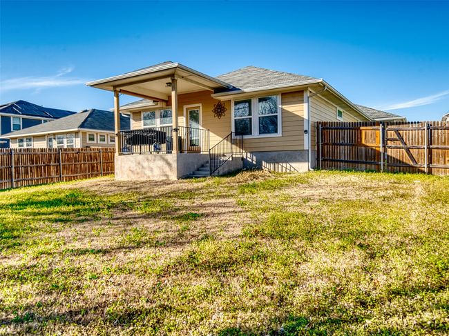 Rear view of house with a lawn | Image 20