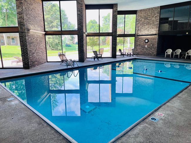 Floor to ceiling windows flood the pool room with natural light | Image 19