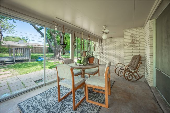 Sunroom featuring outdoor dining space and ceiling fan | Image 19