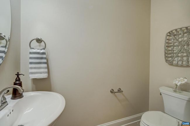 Powder room with pedestal sink. | Image 24
