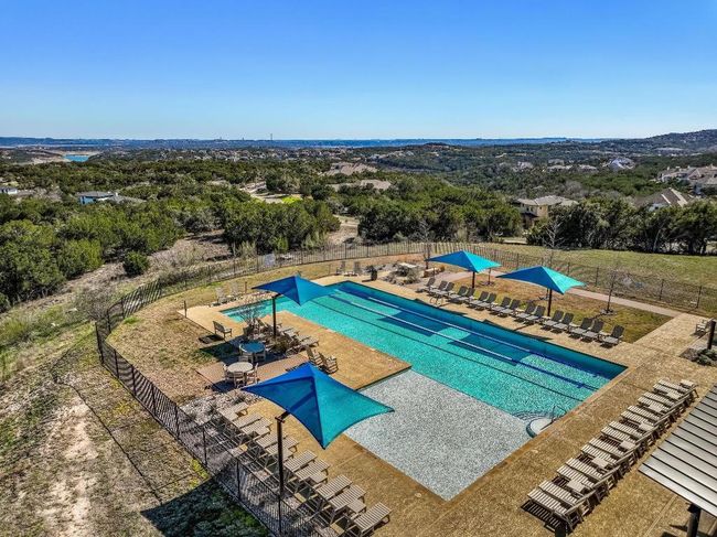 The Trailhead Club is just one block over from the house and features a lap-style pool, a covered patio, sports courts, playground and more. With breathtaking views of the Hill Country and Lake Travis, the Trailhead Club is the perfect place to meet up with family and friends in The Canyons sections of The Hollows. The HOA organizes a variety of resident events throughout the year, offering fun opportunities for neighbors to connect and enjoy themselves.... | Image 40