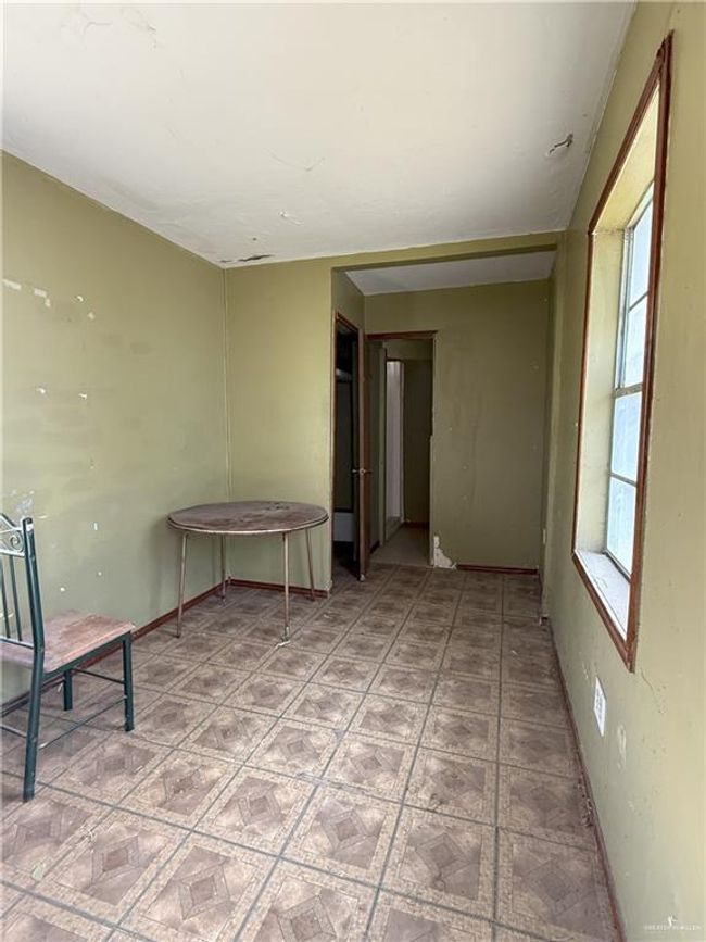 Empty room featuring a wealth of natural light | Image 6