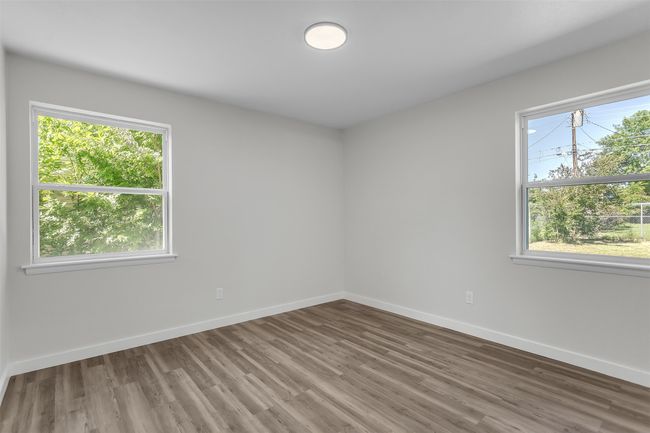 Unfurnished room with wood finished floors and baseboards | Image 11