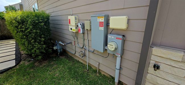 Exterior view of electric meter and solar equipment energy utilities | Image 5
