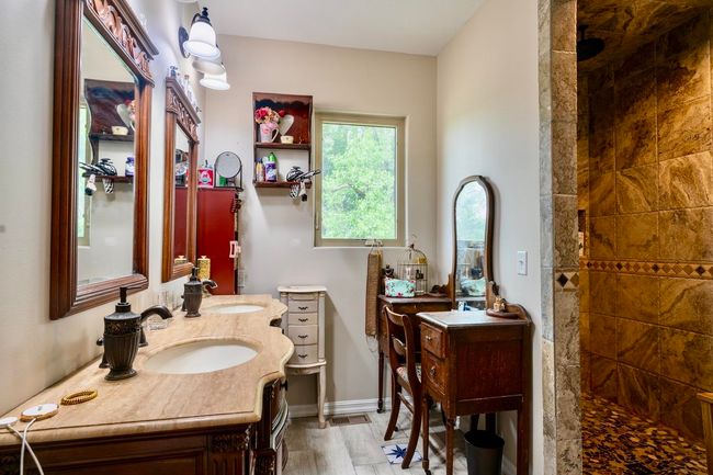Bathroom featuring vanity and walk in shower | Image 24