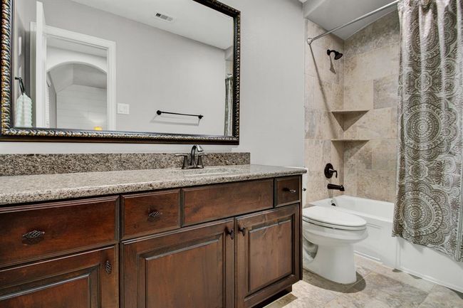 Private ensuite bath located off the 4th secondary bedroom. | Image 33