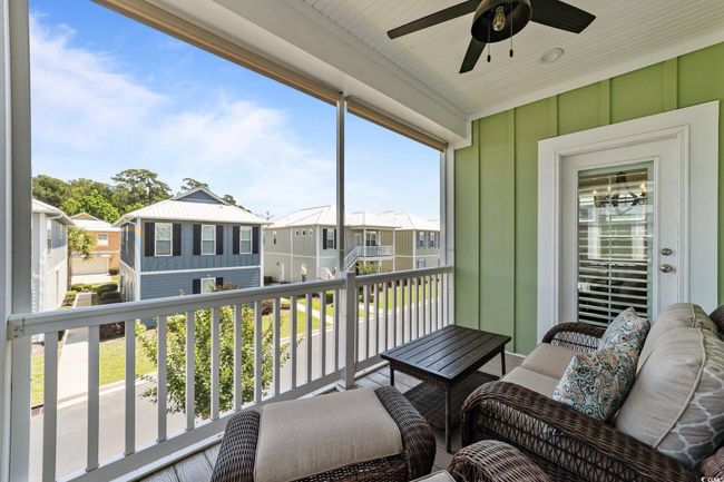 Balcony with a ceiling fan and a residential view | Image 31