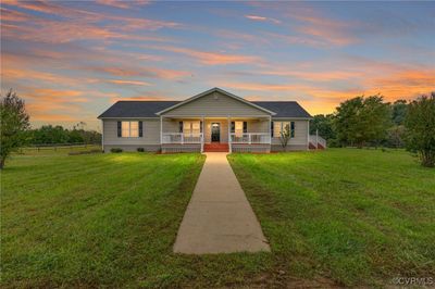 View of front facade featuring a porch and a lawn | Image 1