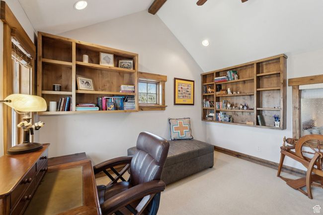 Carpeted office space with vaulted ceiling with beams, recessed lighting, and a ceiling fan | Image 26
