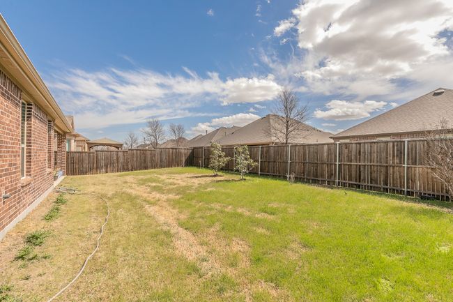 View of yard with a fenced backyard | Image 18