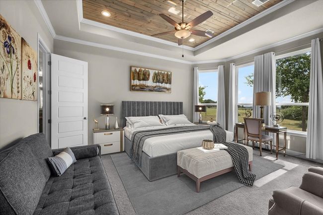 Primary bedroom featuring a tray ceiling | Image 7