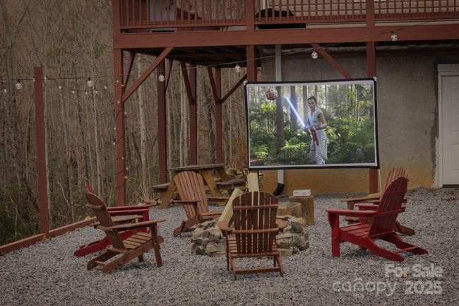 Outdoor Area with Firepit and Movie Screen | Image 5