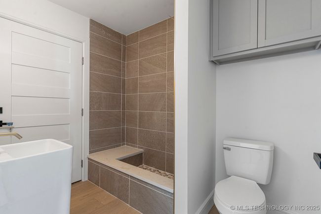 Sun room bathroom withy exterior access to pool and dog washing station | Image 68