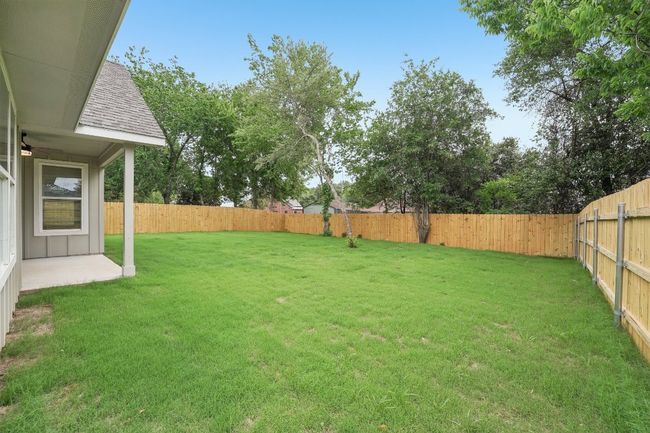 View of yard with a fenced backyard | Image 36