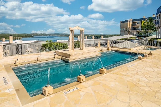 Community pool featuring a patio area and a water view | Image 39