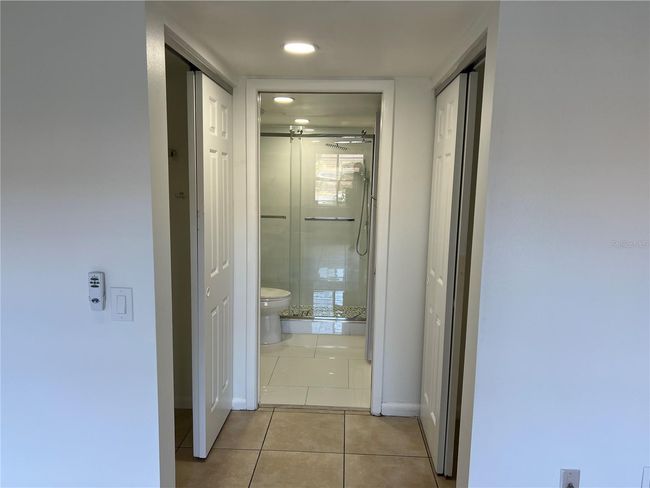 entry to master bath / his and Her's closet | Image 20