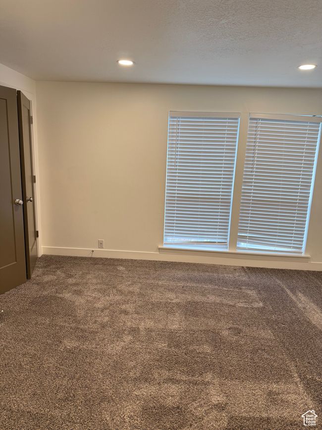 Carpeted spare room featuring baseboards and recessed lighting | Image 7