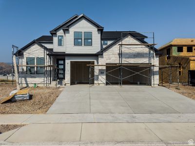 Craftsman-style home featuring a front yard and a garage | Image 1