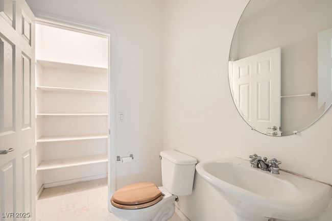 Bathroom with a sink and toilet | Image 15