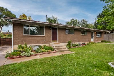 Ranch-style home with a front lawn | Image 1