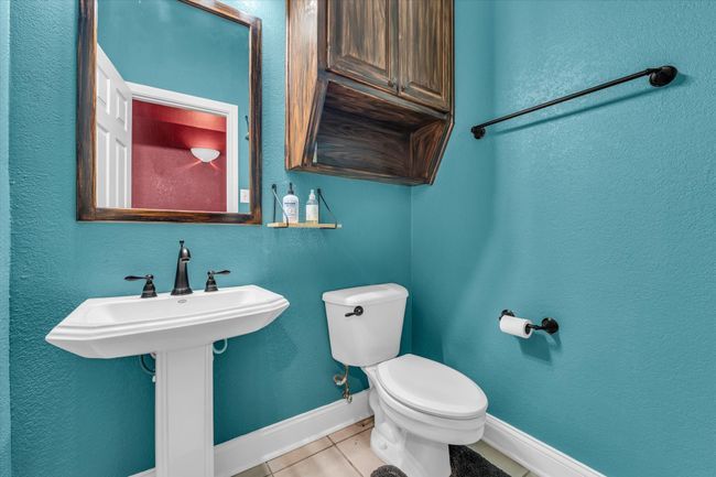 Bathroom featuring tile patterned floors, toilet, and baseboards | Image 27